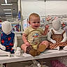 Silvia joined the competition — help win amazing prizes! baby, child, mannequin, store, clothing, sitting, retail, display, boots, shelf, cute, shopping, apparel, infant, smiling, inside, fashion, toy, background, person
