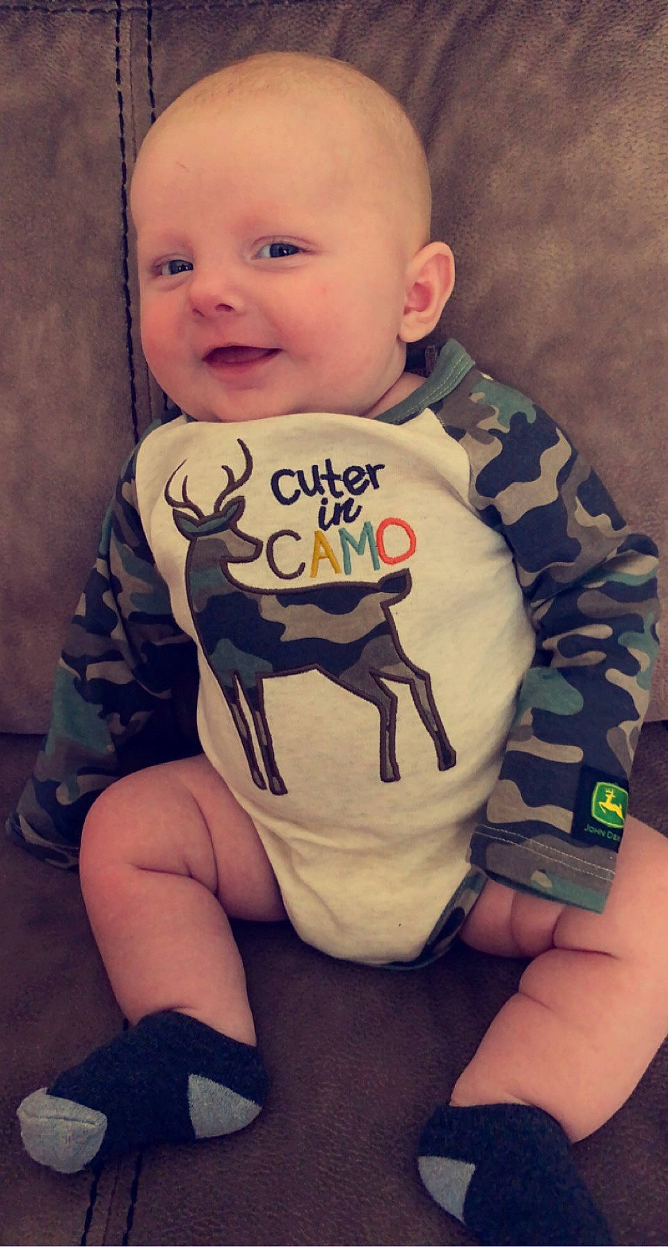 Rowdy is registered to the contest to win money with this photo: baby_toddler_clothing, cheek, eye, face, facial_expression, hair, head, human_body, joint, leg, mouth, neck, nose, organ, outerwear, person, product, shoulder, skin, smile