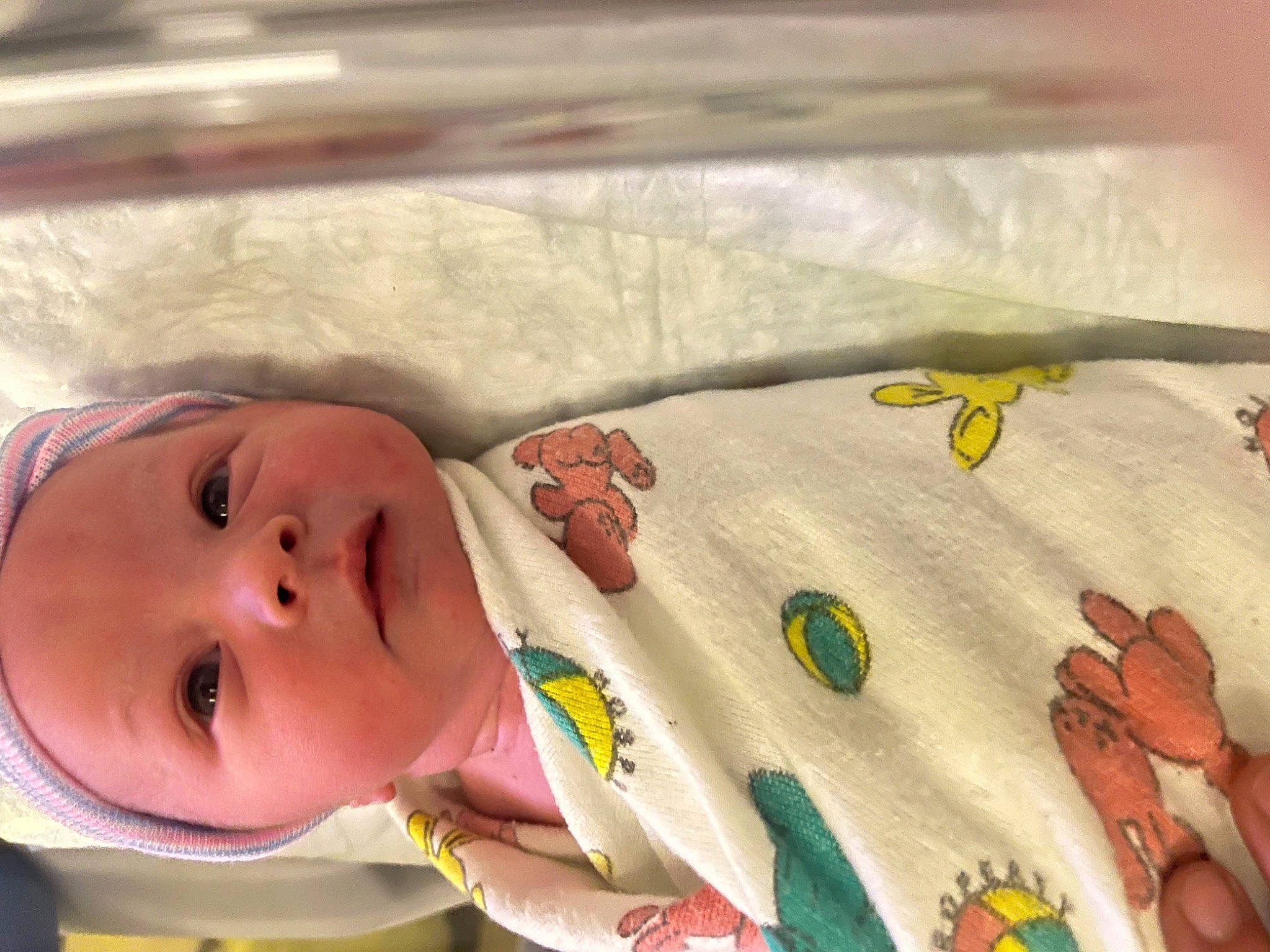 Kanan is registered to the contest to win money with this photo: art, baby, baby_products, baby_safety, baby_toddler_clothing, blanket, child, craft, eyelash, fashion_accessory, linens, pattern, person, room, skin, sleeve, toddler, visual_arts, wood