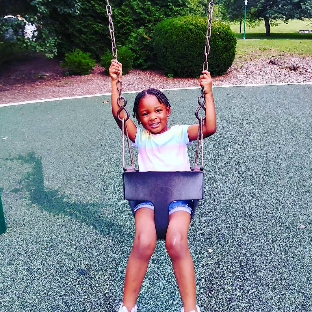 Marley is registered to the contest to win money with this photo: fun, joint, joy, leisure, outdoor_play_equipment, person, physical_fitness, plant, playground, recreation, shoulder, smile, style, summer, swing, tree, vacation