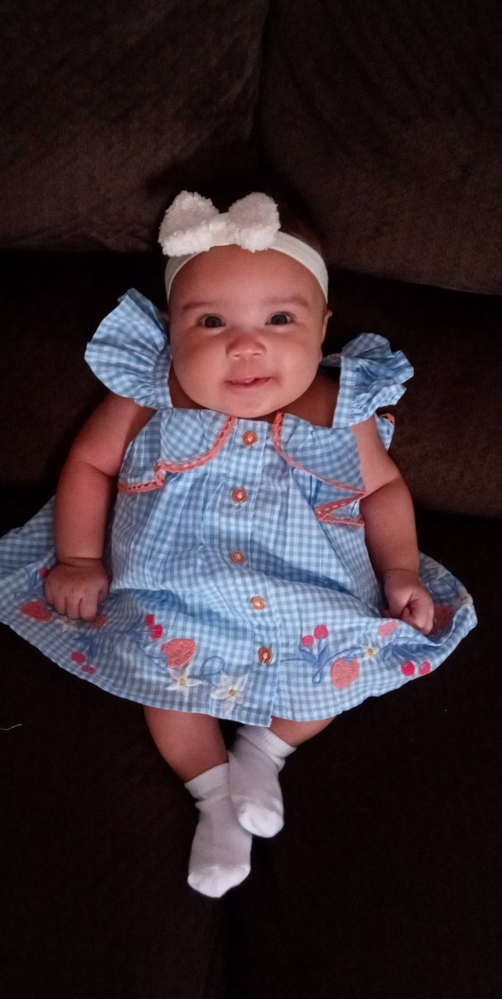 Emersyn joined the competition — help win amazing prizes! baby, baby_toddler_clothing, cheek, child, dress, eye, headgear, headwear, human_leg, lip, pattern, person, pink, plaid, sitting, skin, sleeve, smile, sock, tartan