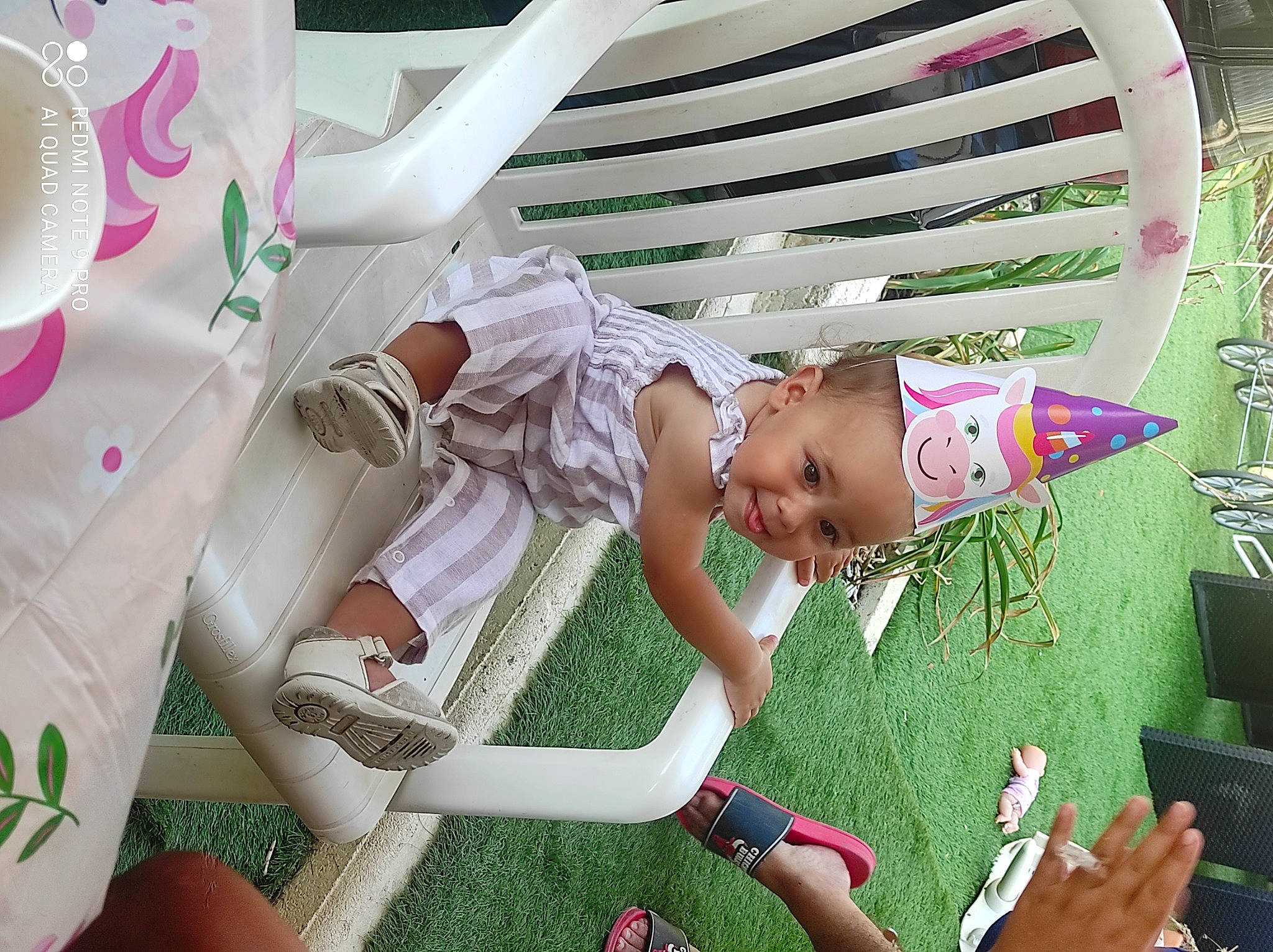 Tessia participe au concours pour gagner de l'argent avec cette photo : baby, baby_products, child, cup, event, fun, grass, happy, hat, joy, leisure, magenta, pattern, person, pink, room, sandal, smile, textile, thigh