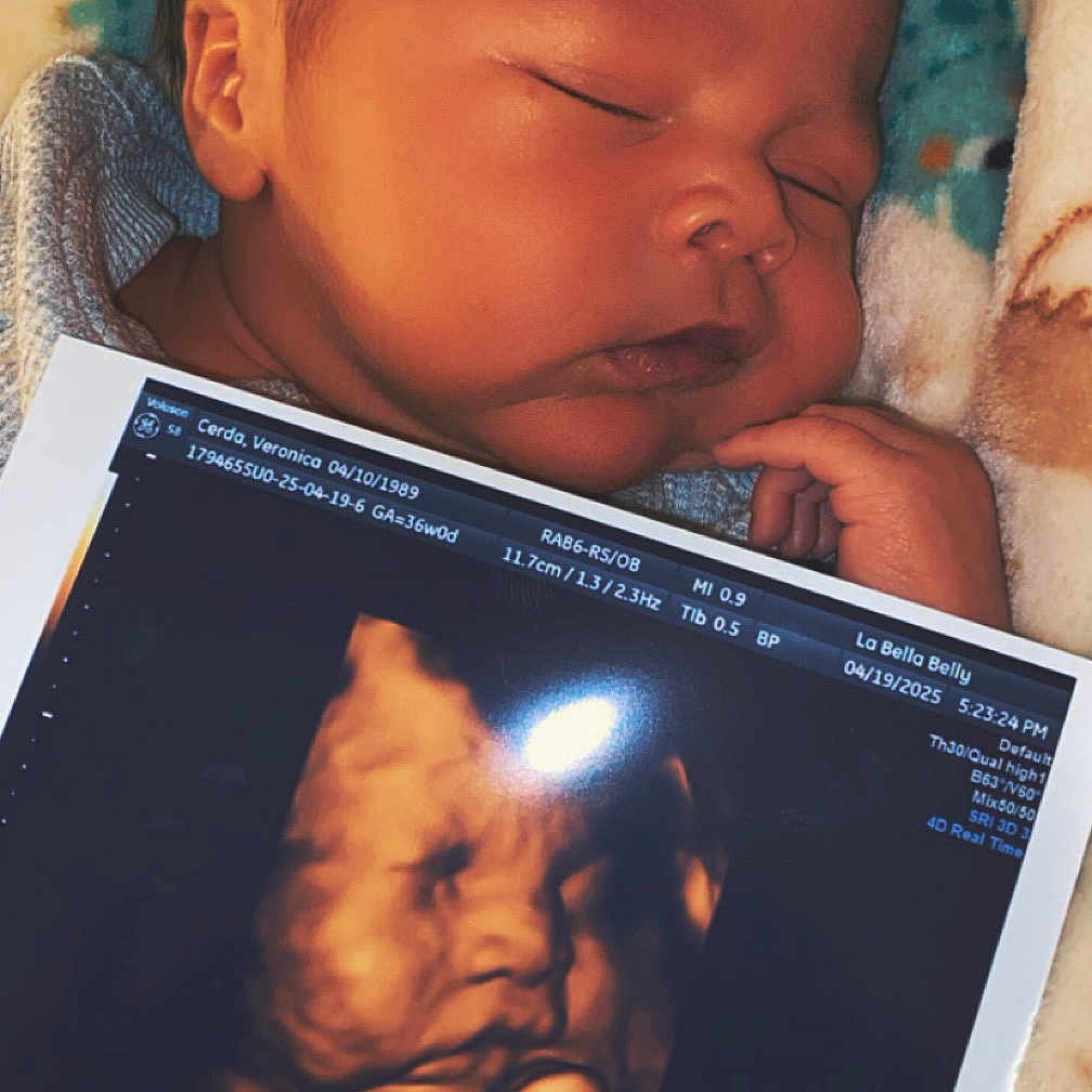 Mikail is registered to the contest to win money with this photo: baby, blanket, bodypart, computer, computerhardware, electronics, face, finger, hand, hardware, head, monitor, newborn, person, photography, portrait, reading, screen, sleeping, tabletcomputer