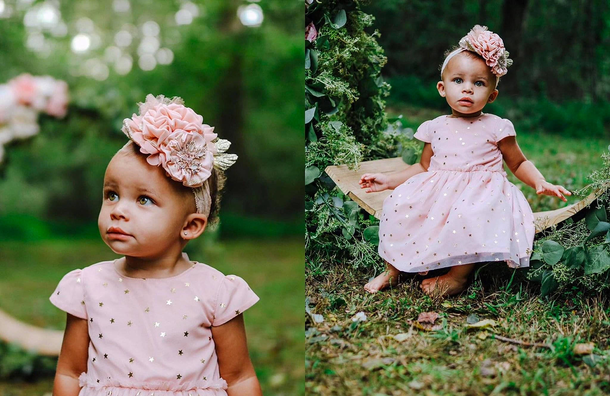 Armani is registered to the contest to win money with this photo: art, baby, baby_toddler_clothing, child, dress, flower, grass, grass_family, green, happy, headgear, headpiece, headwear, jewellery, pattern, people_in_nature, person, petal, pink, plant