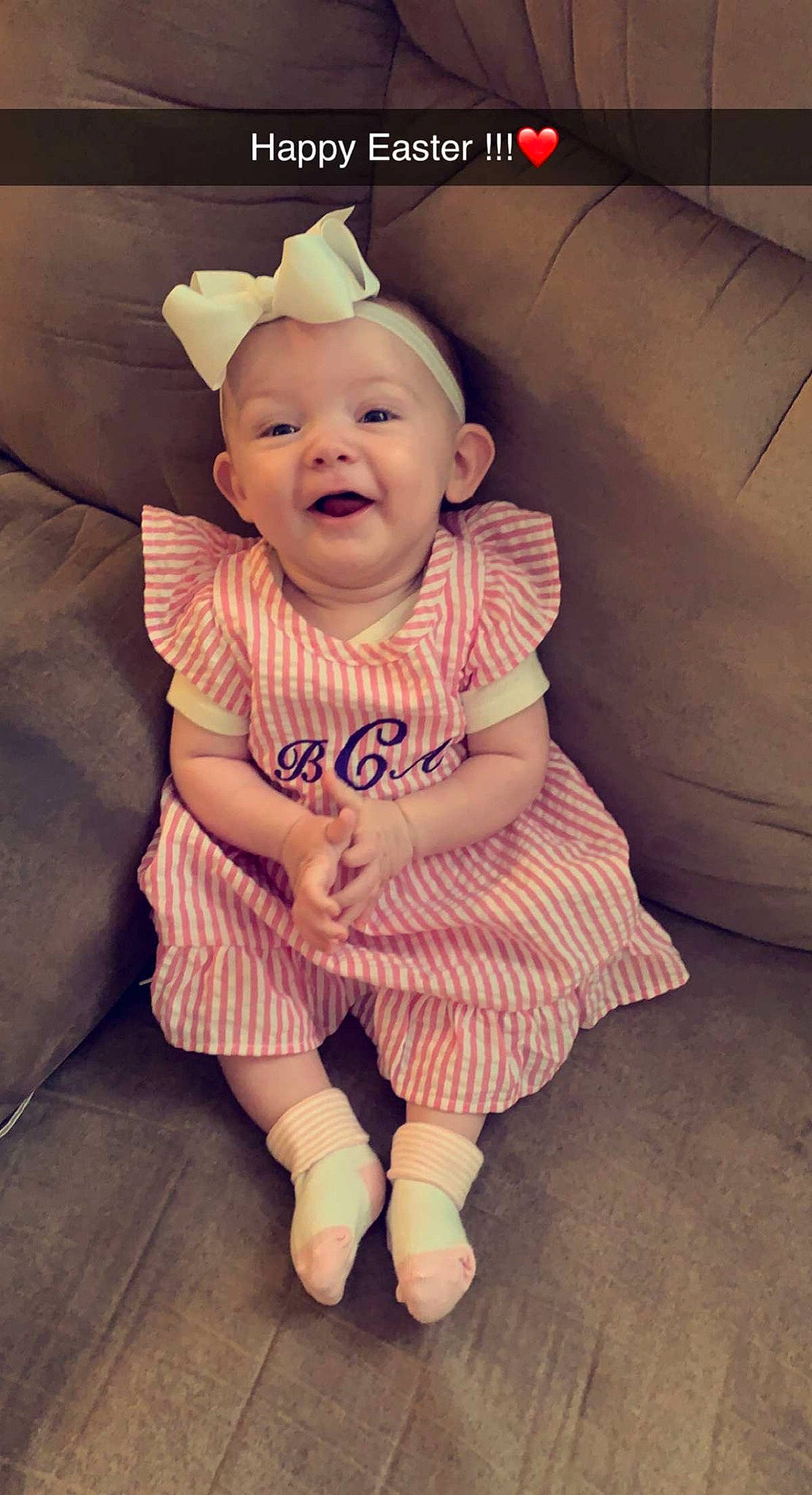 Blakley is registered to the contest to win money with this photo: baby, baby_toddler_clothing, child, comfort, cool, costume_hat, eye, finger, flash_photography, hairstyle, happy, pattern, person, pink, product, sitting, skin, sleeve, smile, t_shirt