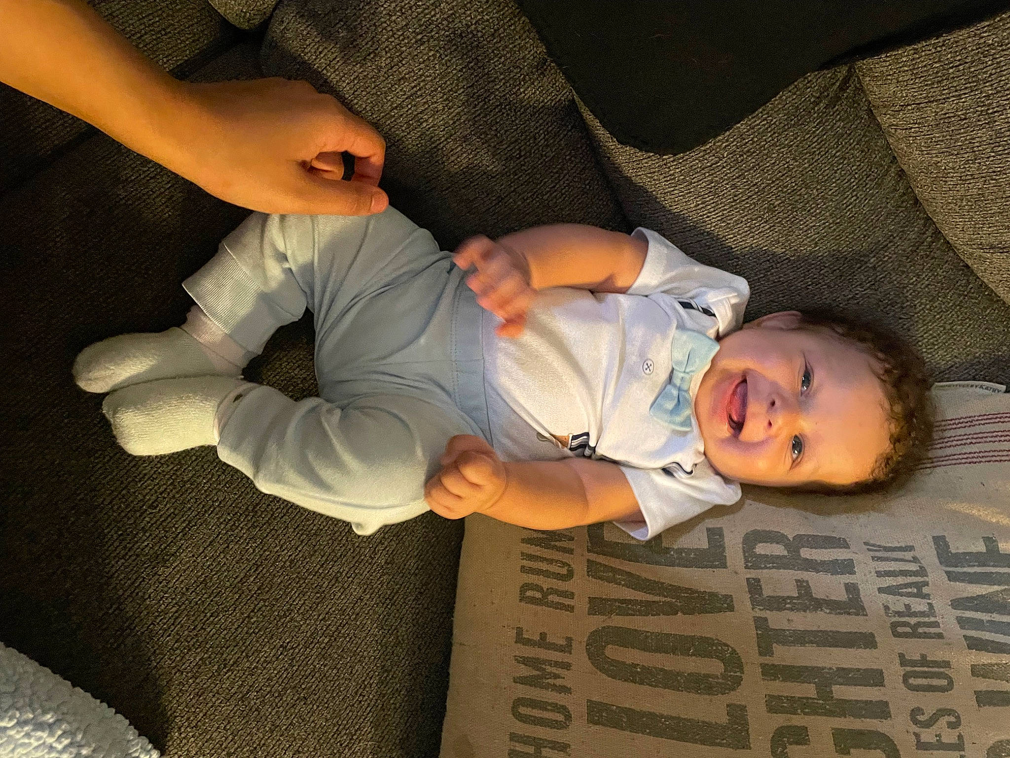 Esther is registered to the contest to win money with this photo: baby_toddler_clothing, child, comfort, elbow, finger, flash_photography, fun, gesture, happy, human_body, human_leg, knee, leg, mouth, person, sleeve, smile, thigh, thumb, toddler