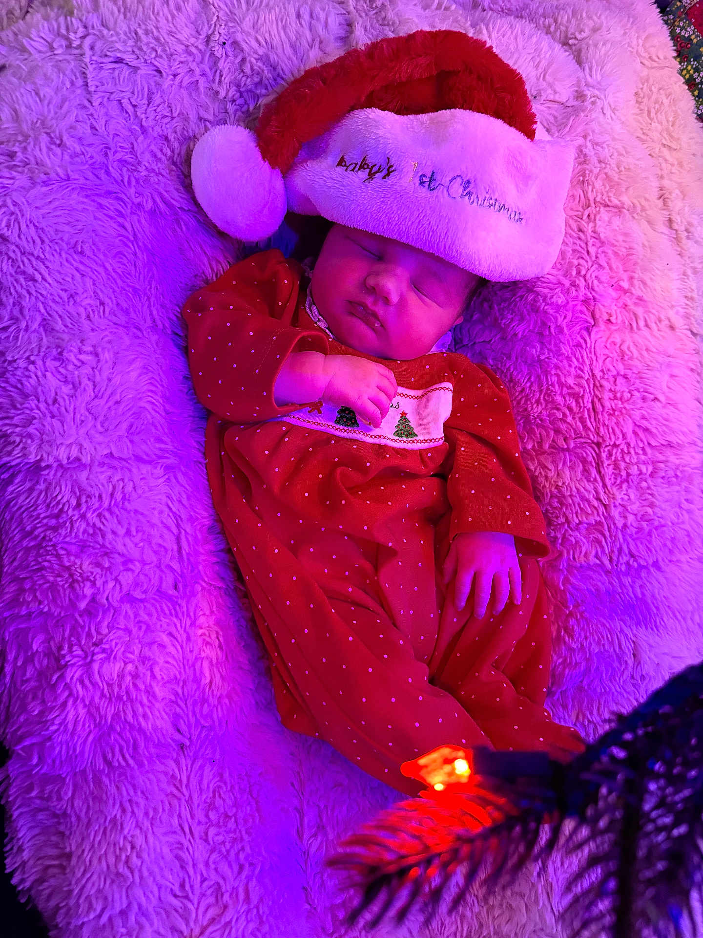 Kennedy is registered to the contest to win money with this photo: baby, sleeping, christmas_hat, red_clothing, plush_blanket, holiday, festive, infant, soft_texture, purple_lighting, cozy, cute, newborn, celebration, christmas, holiday_lights, sleep, indoors, child, festive_outfit