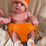 Kairo joined the competition — help win amazing prizes! autumn, baby, blanket, child, cozy, cute, face, fall, hat, holding_hand, indoors, infant, orange, person, plush, pumpkin, sitting, smiling, socks, soft