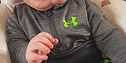 Kairo joined the competition — help win amazing prizes! baby, baby_chair, bear_pattern, chair, child, clothing, container, cute, face, hand, happy, indoor, infant, jacket, pants, person, sitting, smiling, toy, under_armour