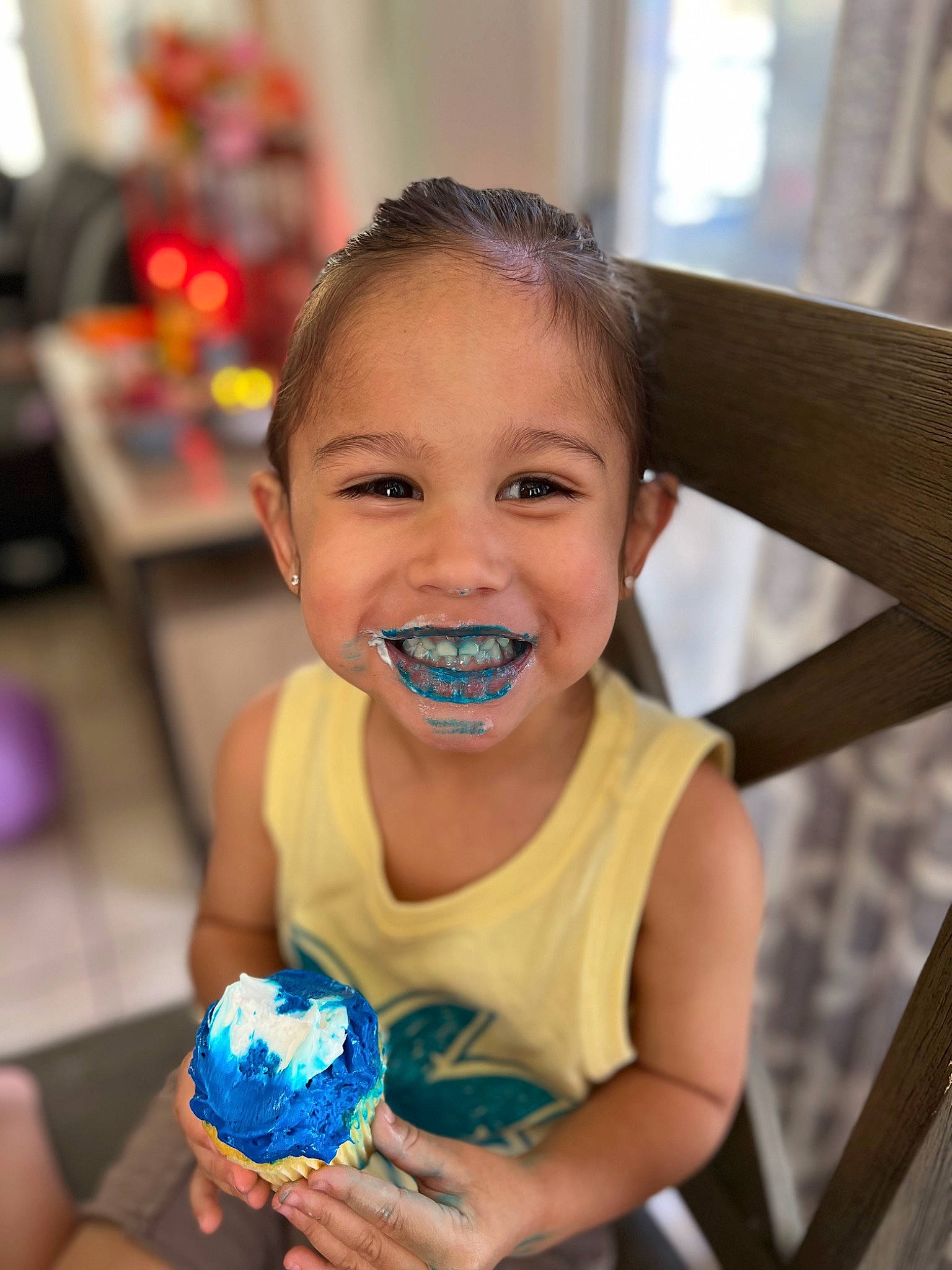 Kingsly is registered to the contest to win money with this photo: chair, child, dessert, electric_blue, event, finger, food, fun, happy, joy, laugh, leisure, nail, person, play, recreation, sitting, smile, sweetness, t_shirt