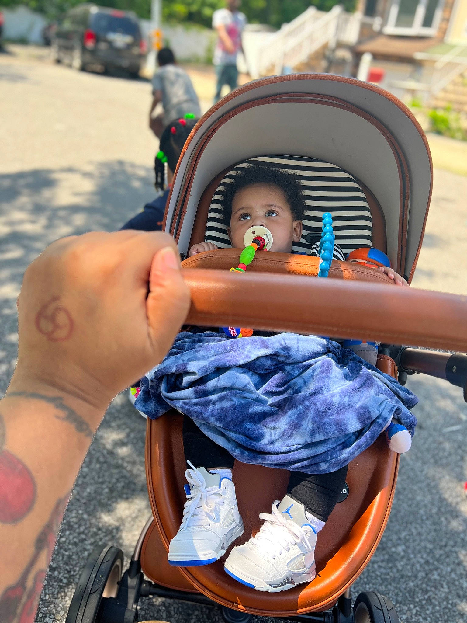 Aidan joined the competition — help win amazing prizes! baby, baby_carriage, baby_products, child, event, eyewear, fashion_accessory, fun, hairstyle, hat, leisure, motor_vehicle, person, personal_protective_equipment, recreation, sitting, street, sun_hat, tire, toddler