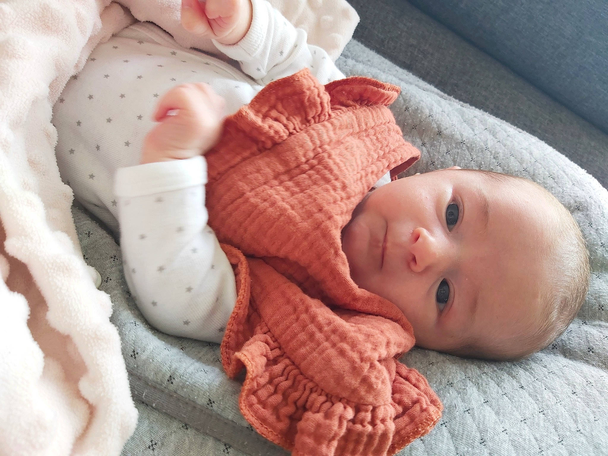 Mya participe au concours pour gagner de l'argent avec cette photo : baby, baby_toddler_clothing, cheek, child, chin, comfort, eye, face, finger, hand, head, headgear, human_body, lip, mouth, nose, person, pink, skin, textile