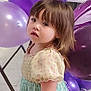 balloons, celebration, child, colorful, curious, curly_hair, cute, dress, event, face, floor, indoor, looking_back, party, person, portrait, purple_balloons, small_child, toddler, young_child