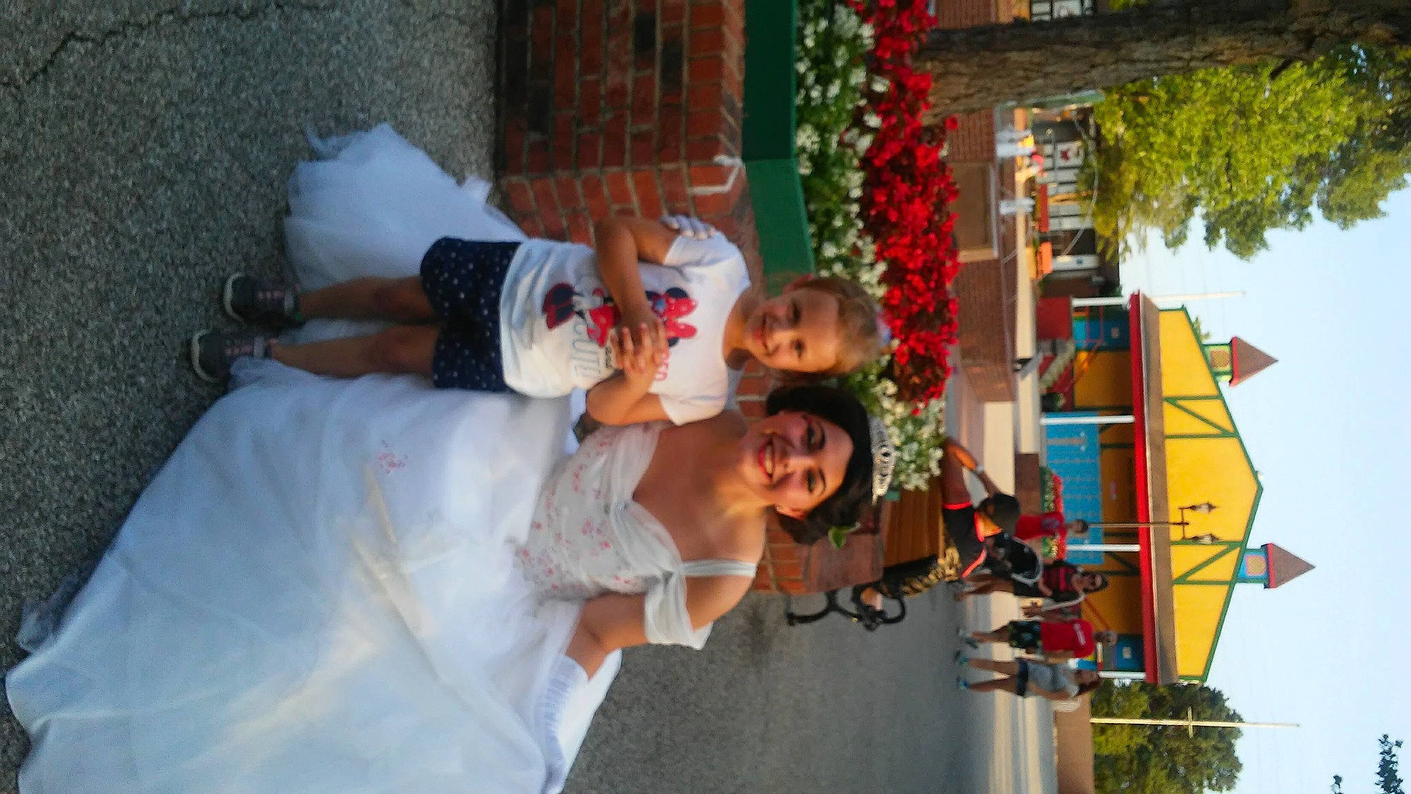 Sarah joined the competition — help win amazing prizes! amusement_ride, bridal_clothing, child, event, floral_design, floristry, fun, happy, headwear, joy, leisure, orange, person, plant, recreation, sky, smile, temple, toddler, tradition