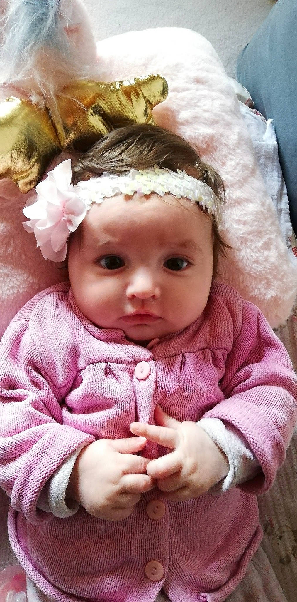 Rubis participe au concours pour gagner de l'argent avec cette photo : baby, baby_toddler_clothing, cap, cheek, doll, dress, eye, eyebrow, eyelash, hand, happy, headgear, headwear, human_body, iris, lip, outerwear, person, pink, skin