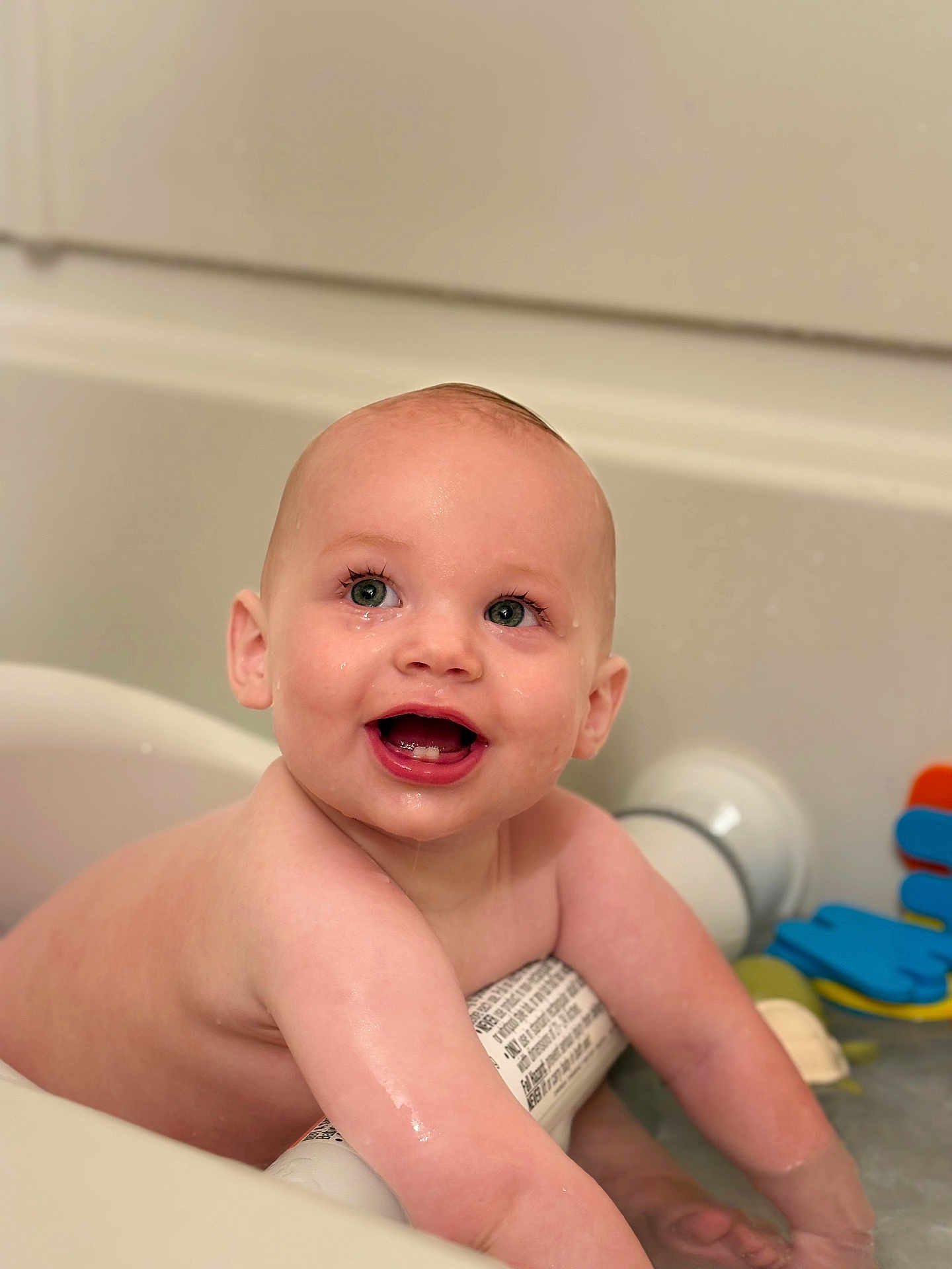 Kodah is registered to the contest to win money with this photo: baby, child, bath, water, smile, happy, wet, skin, toy, bathtub, infant, face, arm, play, splash, cute, childhood, fun, joy, bathroom