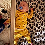 Kodah joined the competition — help win amazing prizes! baby, sleeping, pajamas, yellow_clothing, pacifier, blanket, cow_pattern, infant, crib, foot, rug, soft_texture, indoor, child, peaceful, nap, cute, cozy, toy_pattern, resting