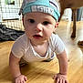 baby, child, crawling, headscarf, milk_pattern, floor, wooden_floor, indoors, dog, pet, curious, white_clothing, hands, face, eyes, mouth, home, animal, person, infant
