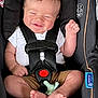 baby, car_seat, smile, infant, child, pacifier, seatbelt, clothing, white_shirt, brown_shorts, barefoot, cute, happy, safety, straps, indoor, person, young_child, seat, comfort