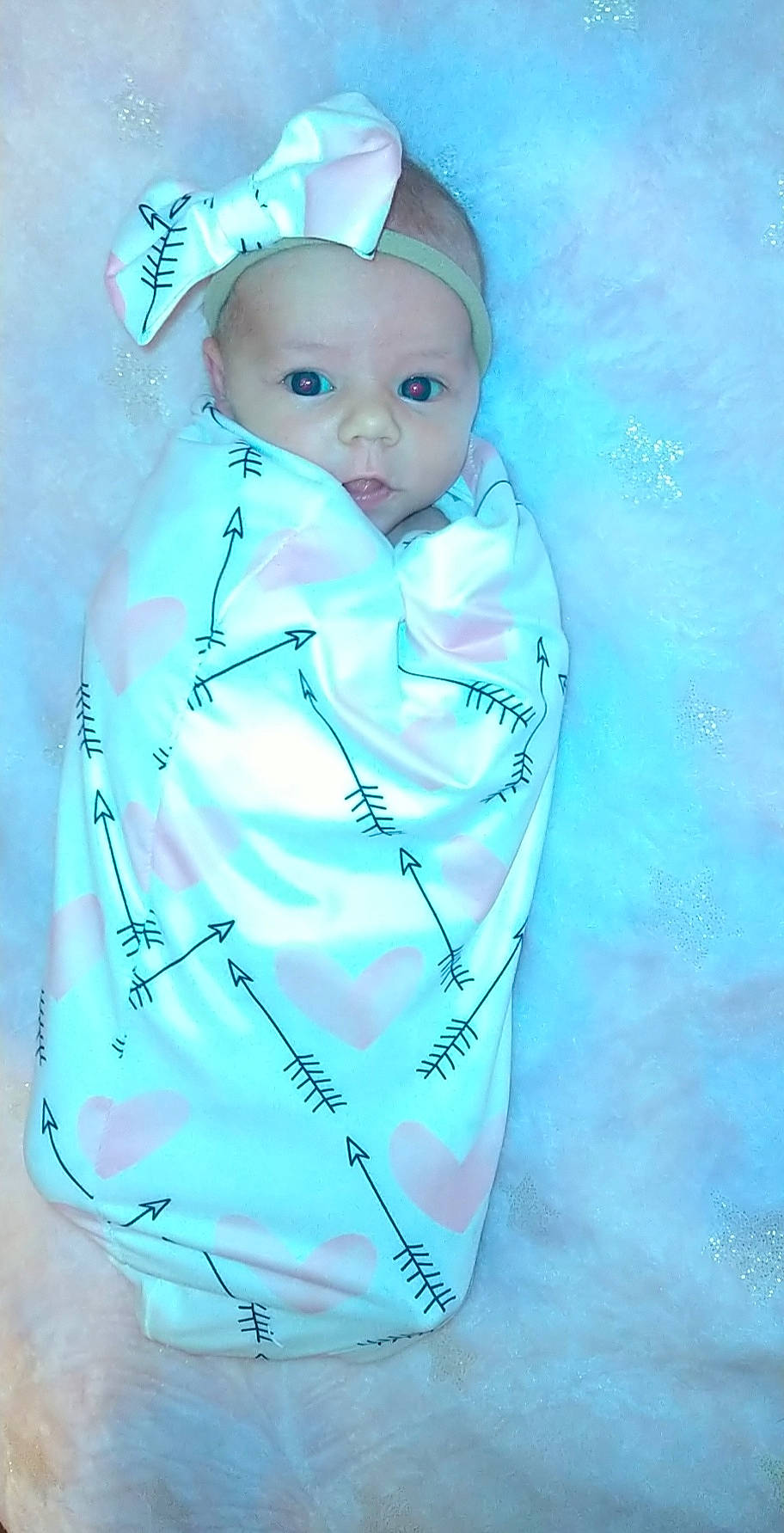 Bridgette is registered to the contest to win money with this photo: aqua, azure, baby, baby_toddler_clothing, cheek, child, electric_blue, eyebrow, eyelash, fashion_accessory, linens, paint, person, plastic, sleeve, t_shirt, toddler