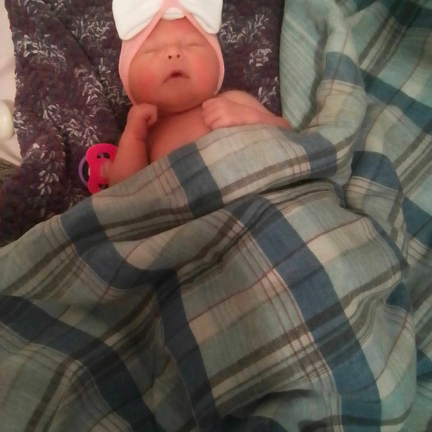 Rosie is registered to the contest to win money with this photo: baby, blanket, bow, child, cozy, cute, face, fist, headband, indoor, infant, knit, newborn, pink, plaid, purple, resting, sleeping, soft, toddler