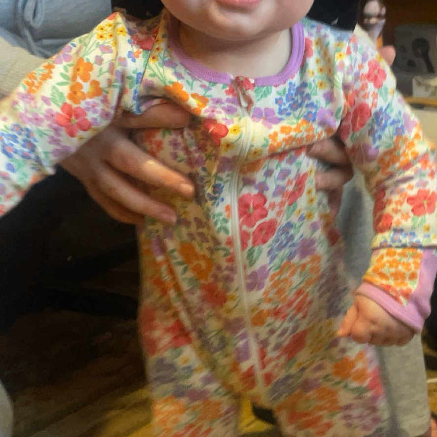 Salah is registered to the contest to win money with this photo: baby, bodypart, clothing, face, finger, footwear, hand, happy, hardhat, hardwood, hat, head, helmet, pajamas, pants, person, photography, portrait, smile, wood