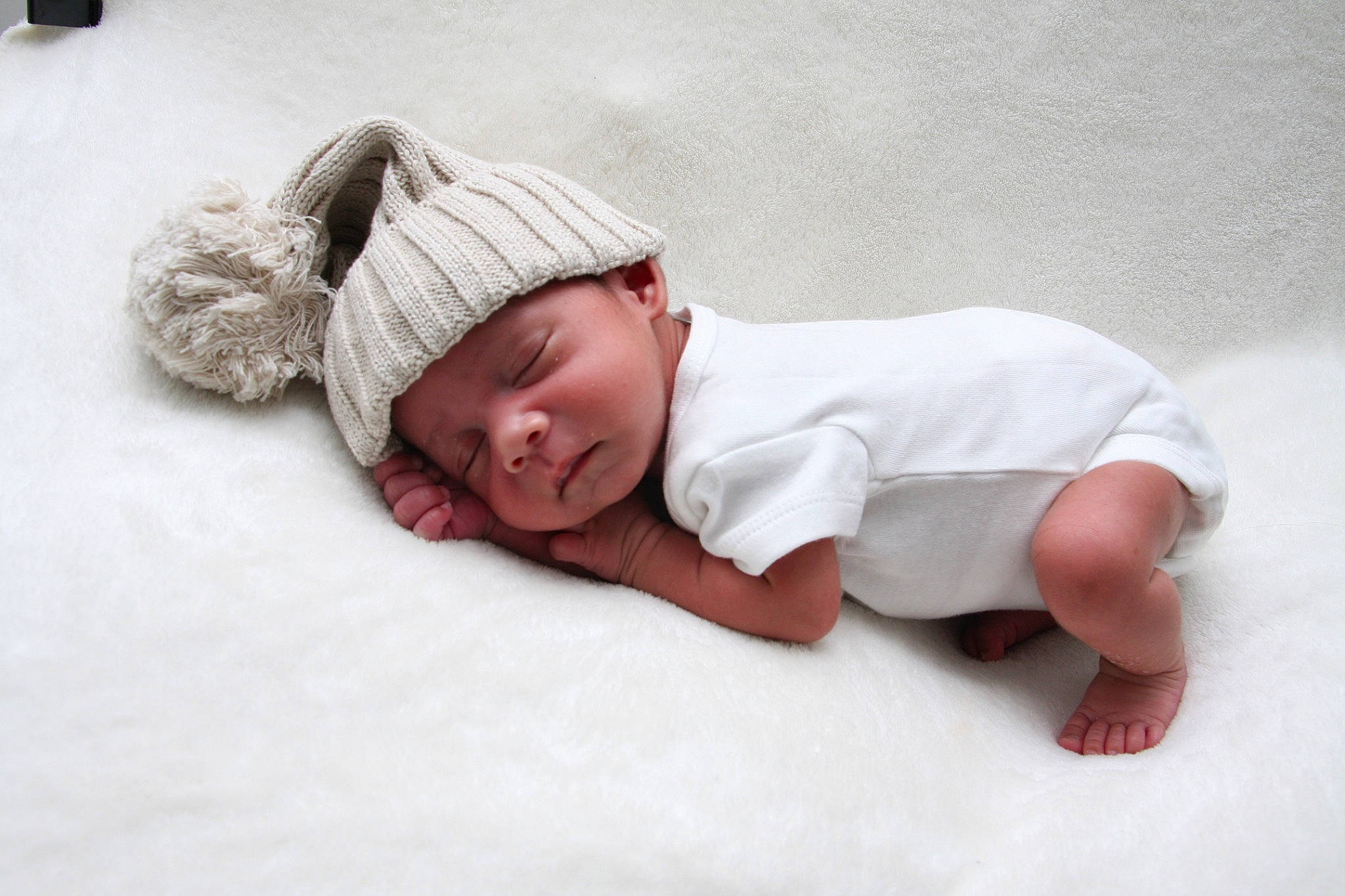 Kyrie joined the competition — help win amazing prizes! baby, baby_sleeping, baby_toddler_clothing, beanie, bedding, bedtime, cap, child, comfort, face, flooring, headgear, headwear, knit_cap, linens, nap, person, sitting, sleeve, toddler