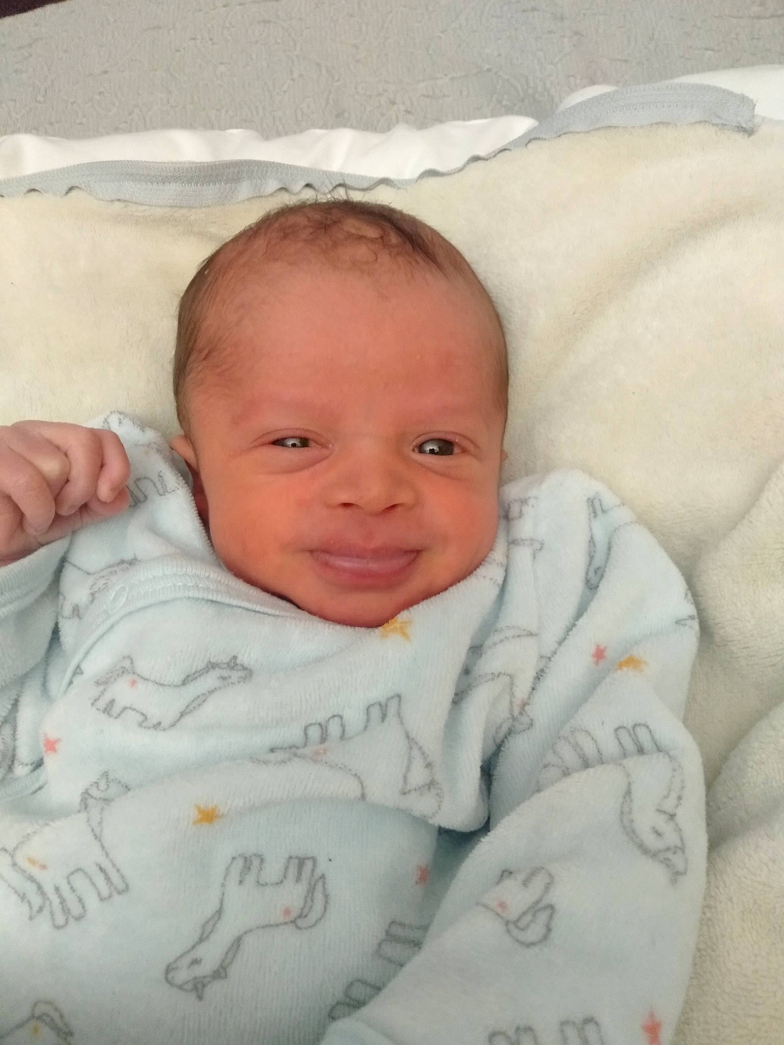 Eden participe au concours pour gagner de l'argent avec cette photo : baby, baby_toddler_clothing, bedding, bedtime, cheek, child, chin, comfort, eyebrow, face, hair, happy, iris, linens, nose, person, skin, sleeve, smile, textile