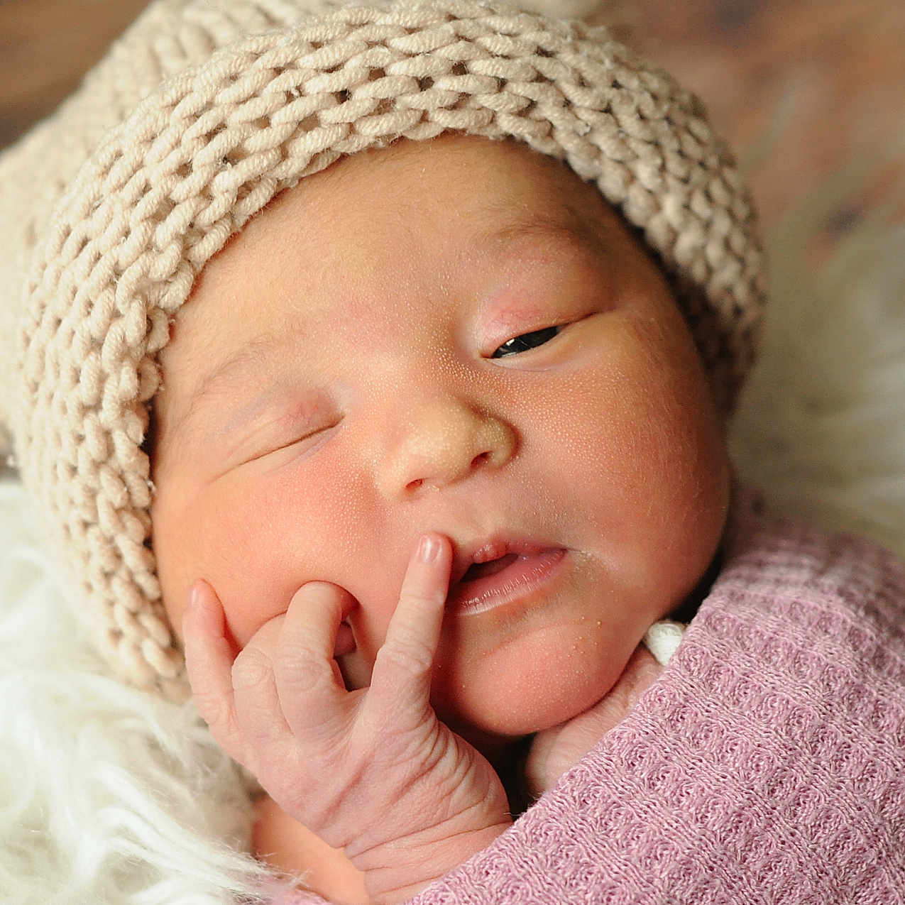 Isabella Marie is registered to the contest to win money with this photo: newborn, baby, infant, knit_hat, blanket, sleepy, face, hand, pom_pom, soft_texture, close_up, candid, cute, resting, wrapped, cozy, fluffy, warm, portrait, child