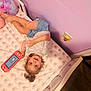 Colby joined the competition — help win amazing prizes! child, toddler, bed, toy, handheld_gaming_device, pink, purple, striped_shirt, shorts, stuffed_animals, elephant_pattern, bedroom, floor, person, smiling, curly_hair, sleepwear, playing, happy, interior