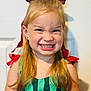 child, cute, expression, eyebrows, face, girl, green_dress, grin, happy, indoor, light_skin, long_hair, person, playful, portrait, red_bow, smile, striped_clothing, teeth, young