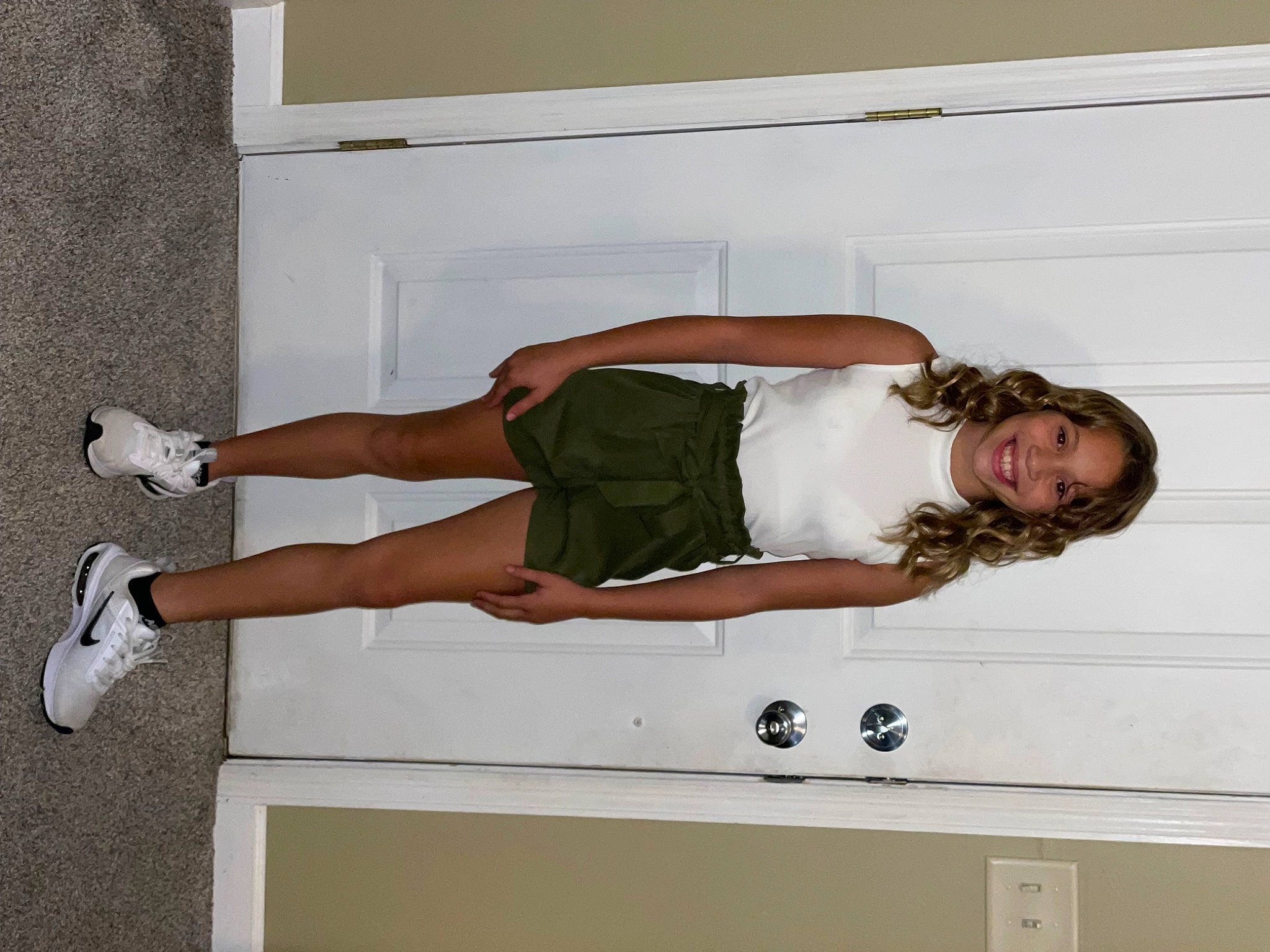 Arianna joined the competition — help win amazing prizes! abdomen, balance, calf, chest, comfort, elbow, foot, hip, human_leg, joy, knee, person, physical_fitness, room, sandal, shorts, stomach, thigh, trunk, waist