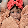 child, face, blanket, bow, headband, portrait, closeup, eyes, expression, soft, warm, cozy, infant, baby, cute, clothing, texture, fabric, hair, snug
