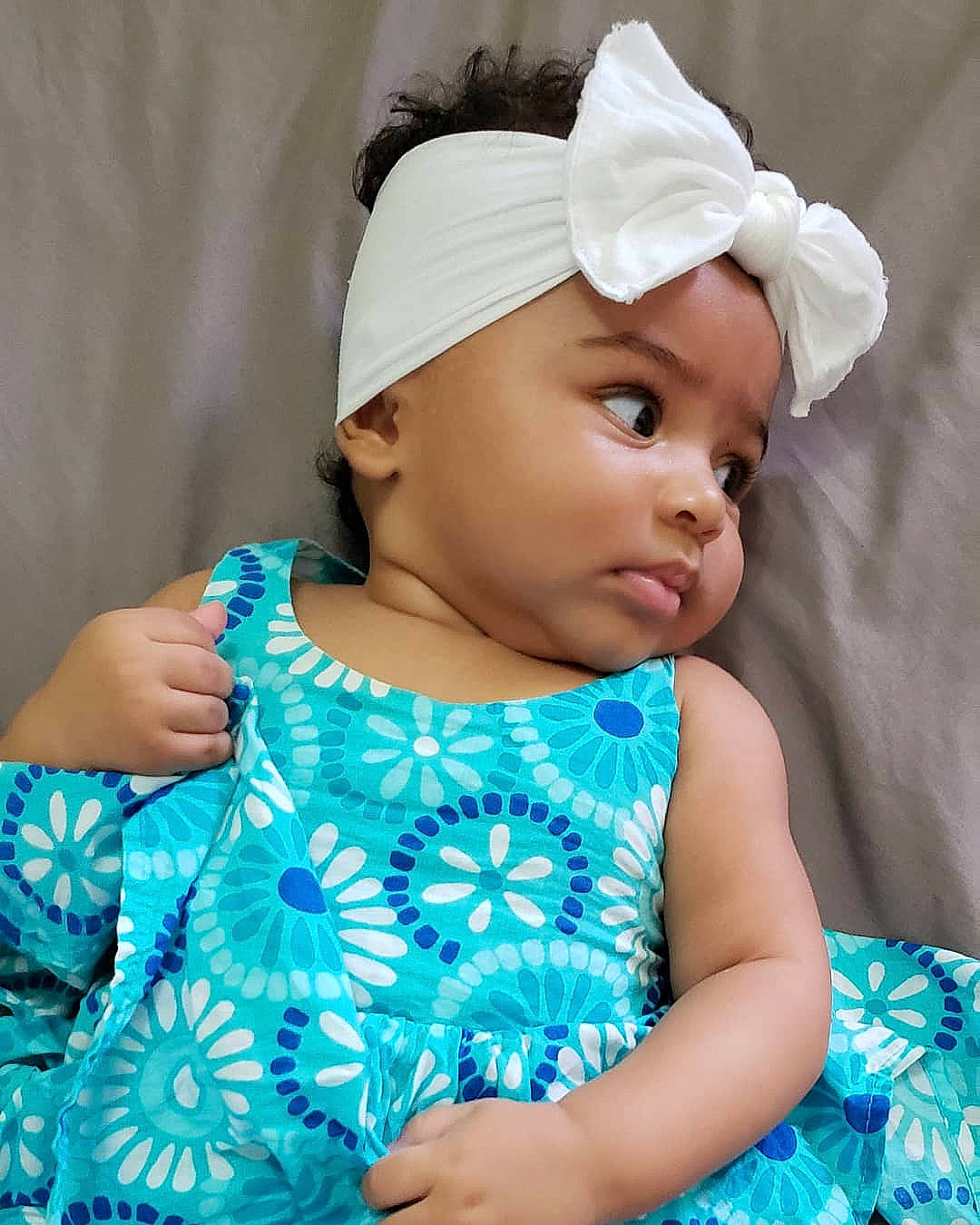Crayton is registered to the contest to win money with this photo: aqua, azure, baby, baby_toddler_clothing, beauty, blue, cap, dress, eye, face, facial_expression, hairstyle, happy, headgear, headwear, lip, pattern, person, pink, skin