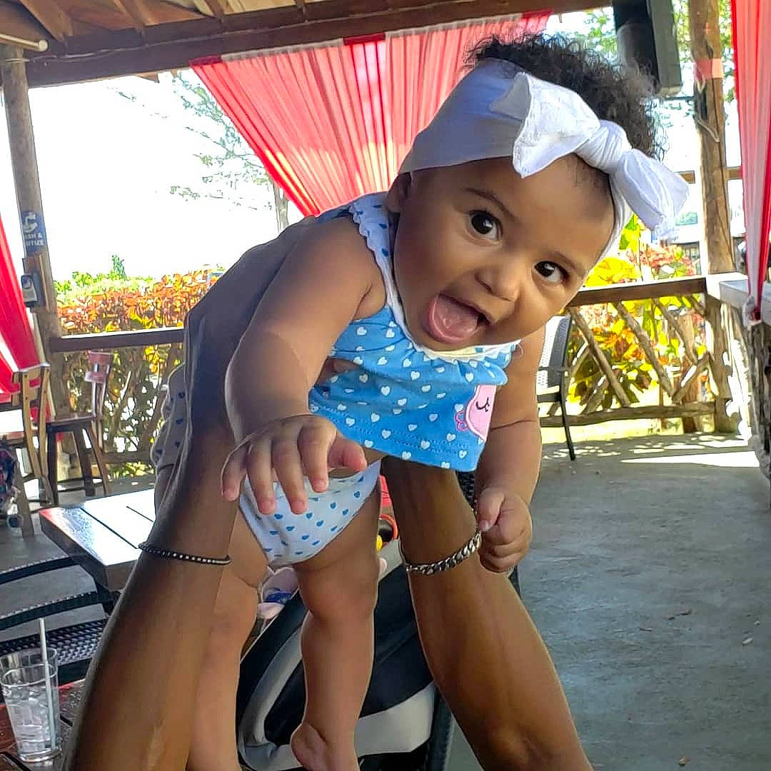 Crayton is registered to the contest to win money with this photo: barefoot, baseball_cap, cap, electric_blue, event, fashion_accessory, foot, fun, happy, hat, human_leg, knee, leisure, person, recreation, sandal, shade, smile, thigh, toddler