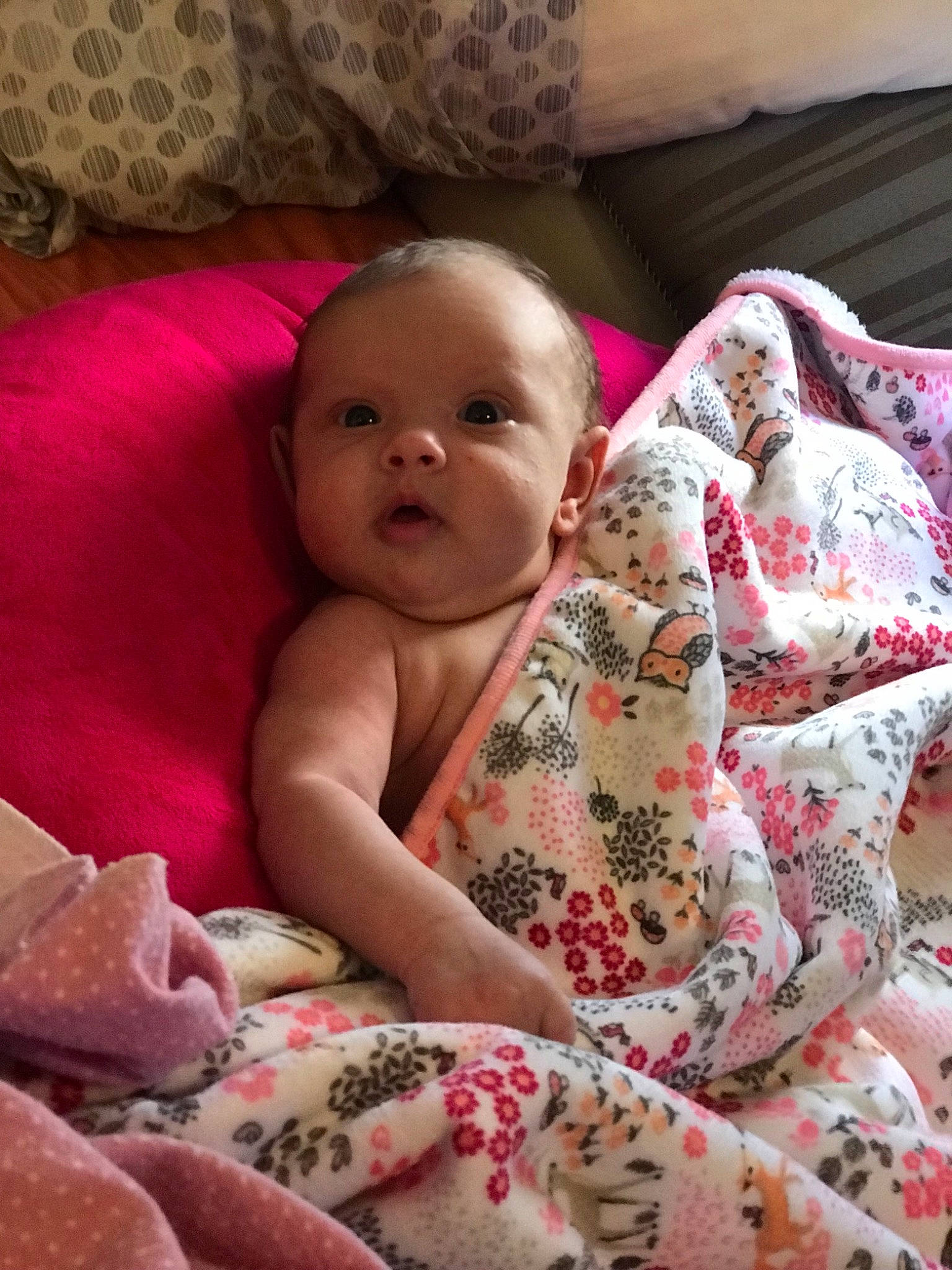 Augustina is registered to the contest to win money with this photo: baby, bedding, blanket, cheek, child, linens, person, pink, skin, textile, toddler