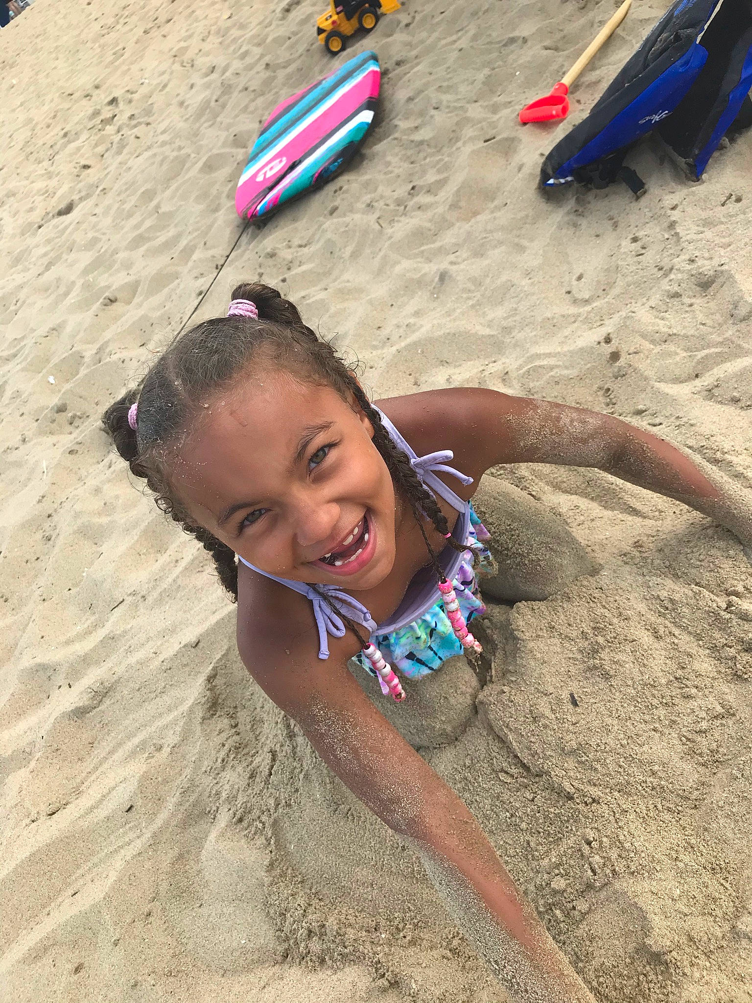 Taleah is registered to the contest to win money with this photo: adaptation, beach, child, fun, hair, happy, head, joy, landscape, leisure, people_in_nature, people_on_beach, person, recreation, sand, smile, soil, summer, t_shirt, toddler