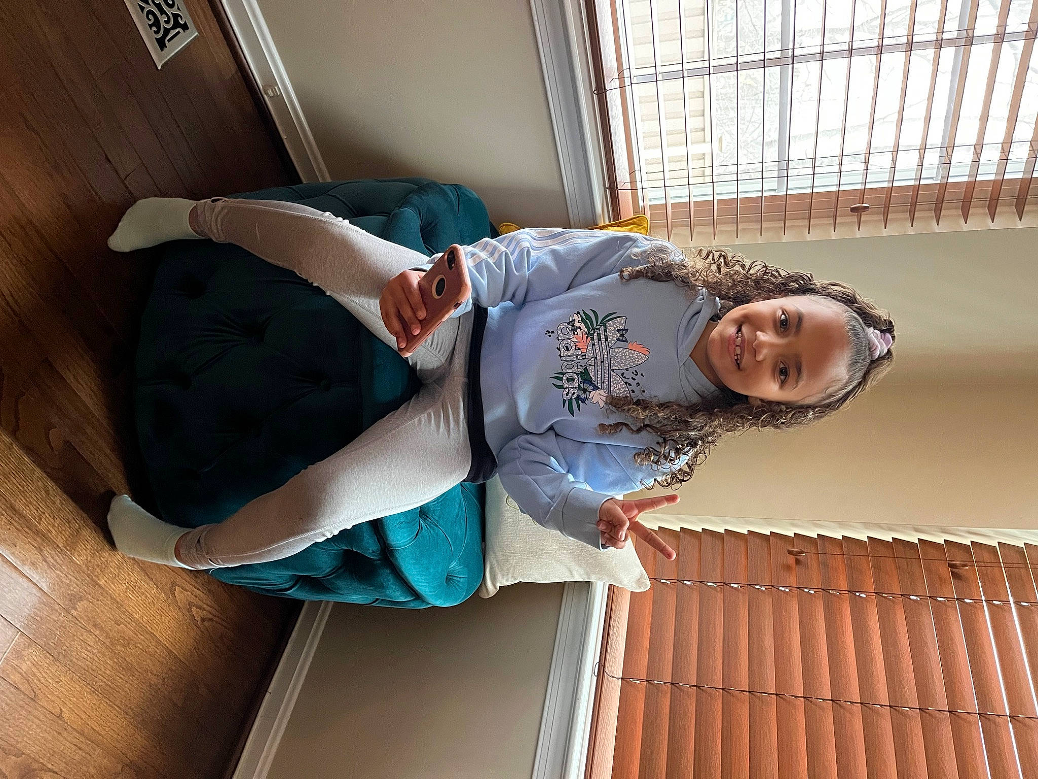 Taleah is registered to the contest to win money with this photo: child, comfort, daylighting, elbow, fun, handrail, happy, hardwood, human_leg, joy, knee, leisure, pattern, person, room, sitting, sleeve, smile, stairs, t_shirt