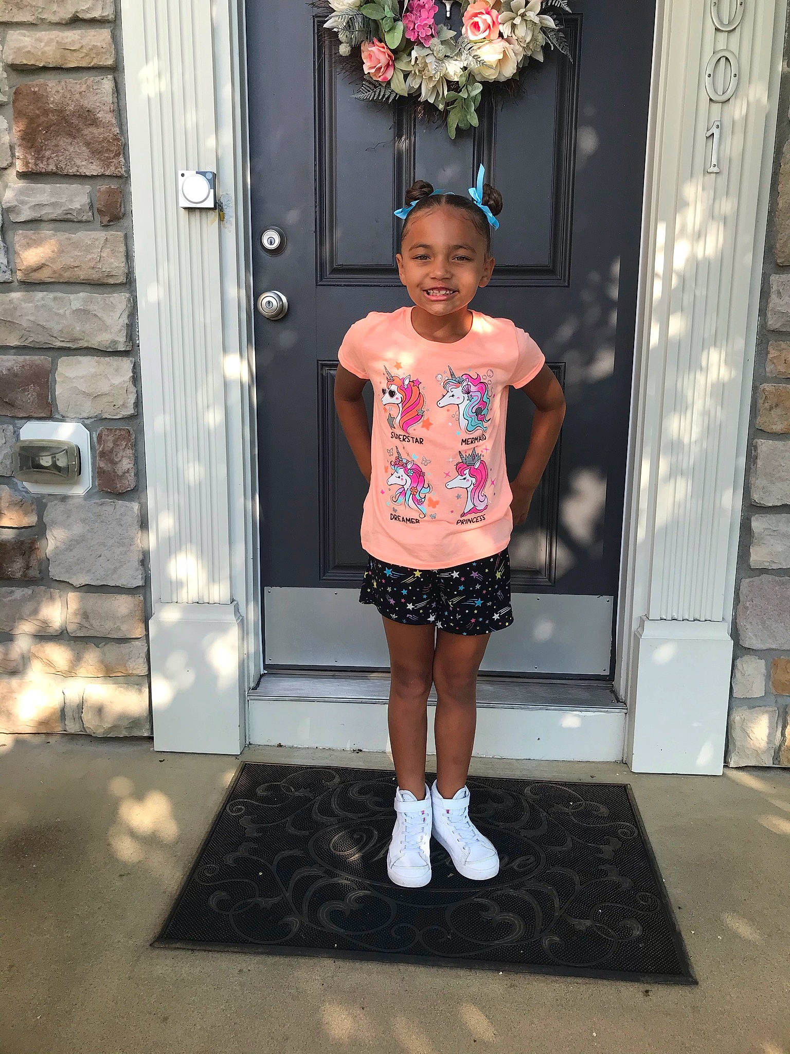 Taleah joined the competition — help win amazing prizes! arm, clothing, door, fashion_design, human_leg, joint, joy, magenta, pattern, person, pink, shorts, sleeve, smile, standing, street_fashion, t_shirt, textile, thigh, toddler