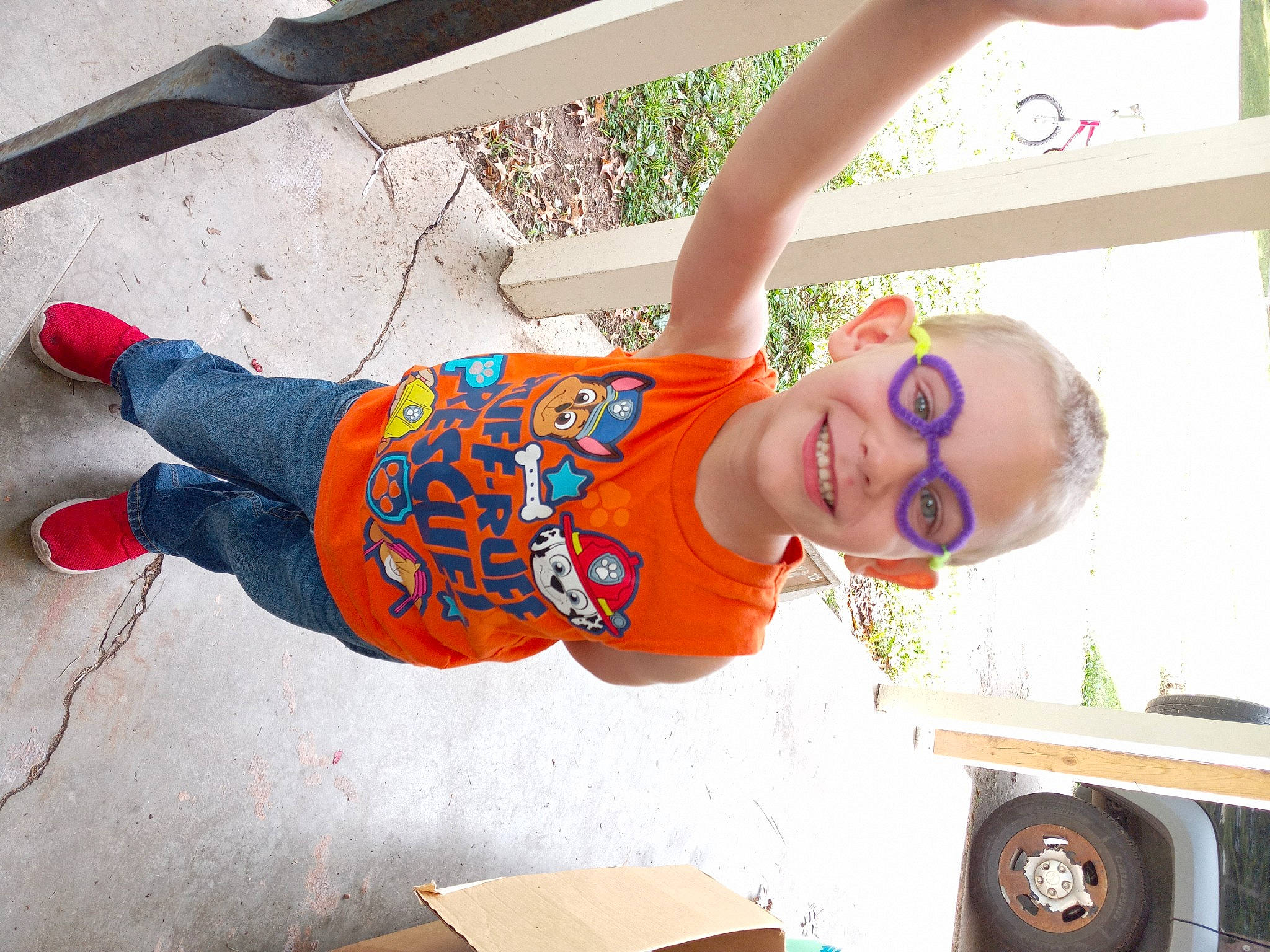 John joined the competition — help win amazing prizes! automotive_tire, child, cool, eyewear, fun, glasses, happy, hat, human_leg, joy, leisure, person, plant, shipping_box, smile, sunglasses, t_shirt, tire, toddler, truck