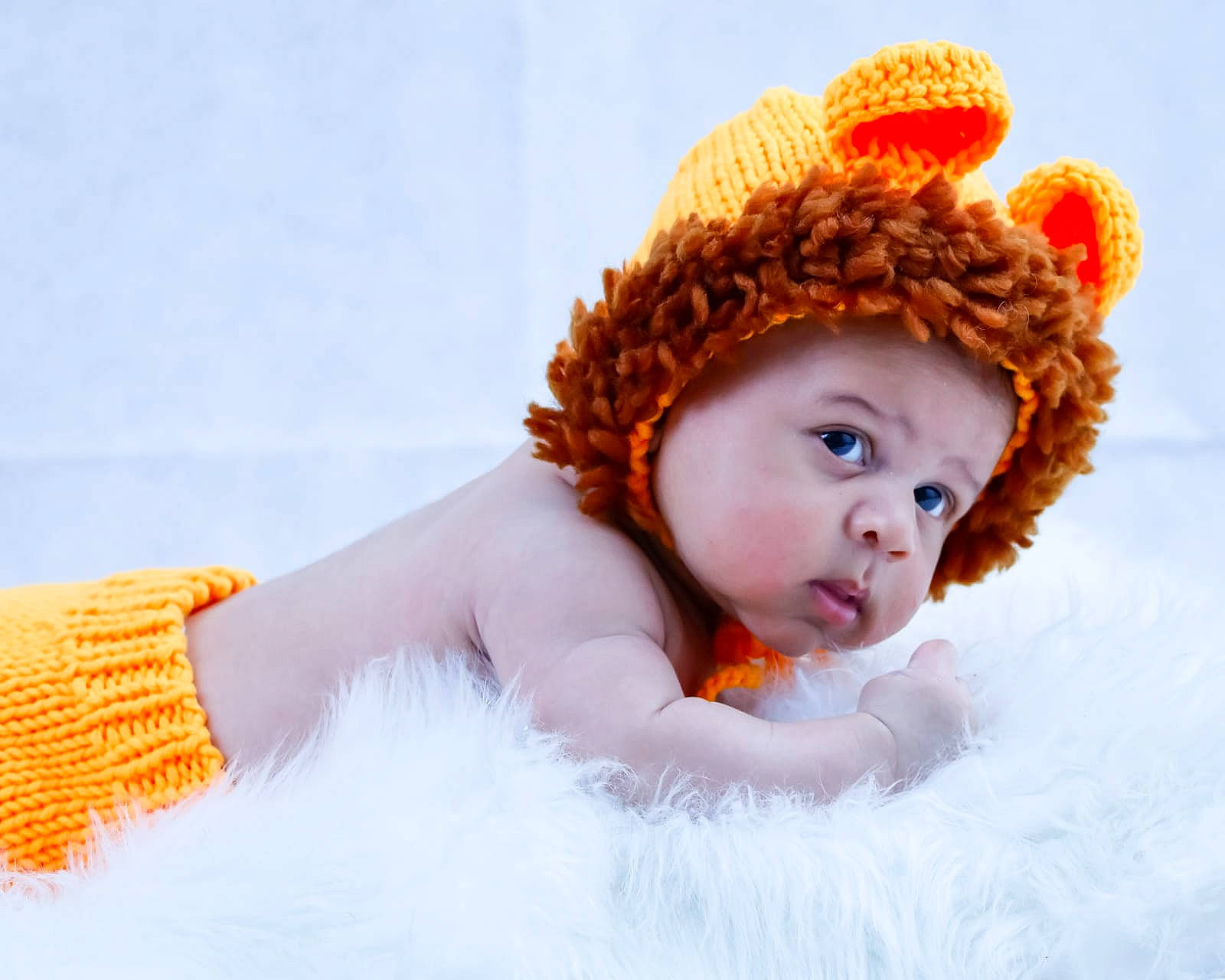Eden participe au concours pour gagner de l'argent avec cette photo : baby, baby_sleeping, baby_toddler_clothing, cap, comfort, costume_hat, freezing, fun, fur, happy, hat, knit_cap, linens, orange, people_in_nature, person, stuffed_toy, textile, toddler, toy