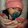 baby, infant, pacifier, pink_hat, nike_logo, blanket, beanie, car_seat, harness, closeup, face, eyes, hands, cozy, newborn, portrait, dim_lighting, soft_texture, sleepy, adorable