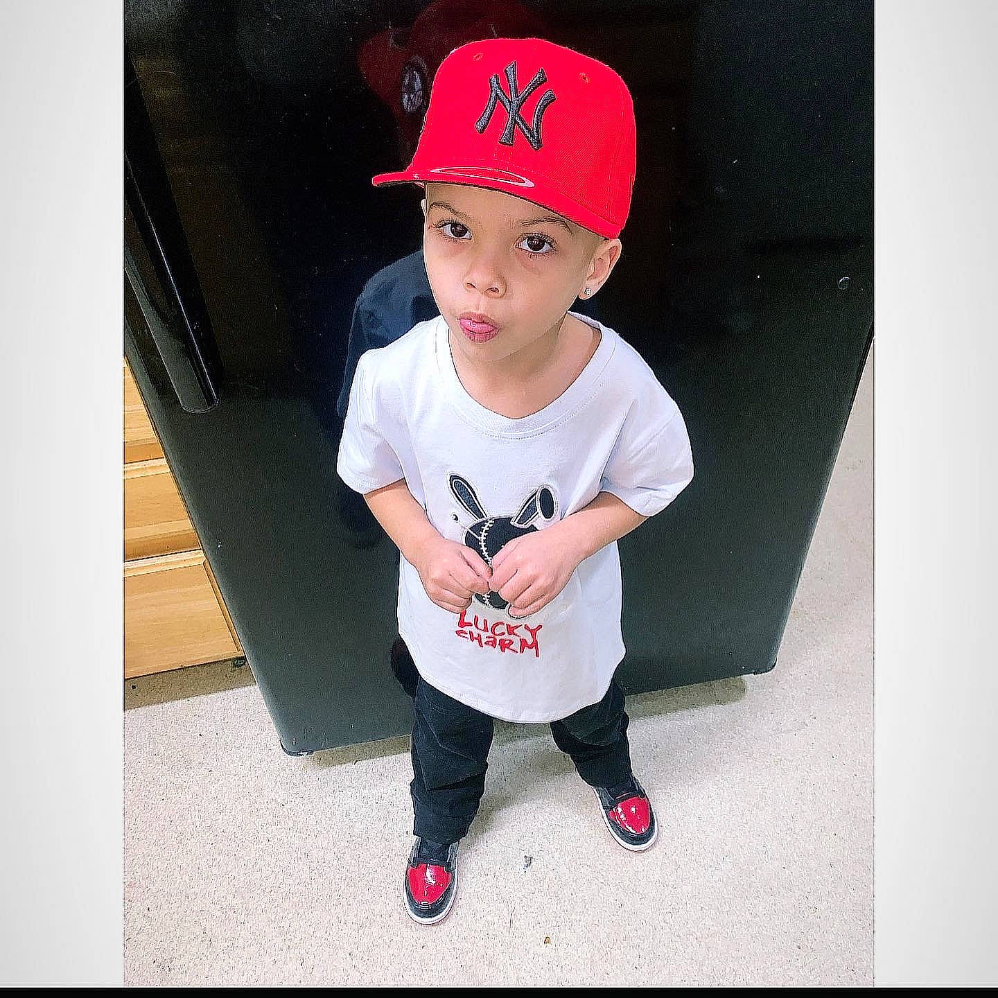 Nasiah is registered to the contest to win money with this photo: baby_toddler_clothing, baseball_cap, cap, carmine, child, clothing, cool, costume_hat, cricket_cap, eyewear, fashion_accessory, flash_photography, happy, headwear, pattern, person, product, rectangle, sleeve, street_fashion