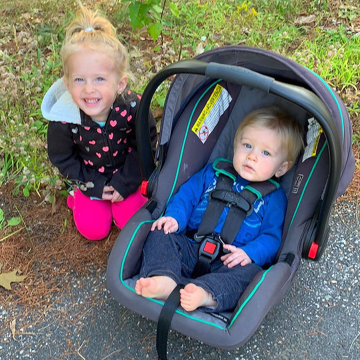 Charlotte is registered to the contest to win money with this photo: baby, baby_carriage, baby_carrier, baby_products, child, joy, leisure, person, plant, play, product, recreation, sibling, toddler