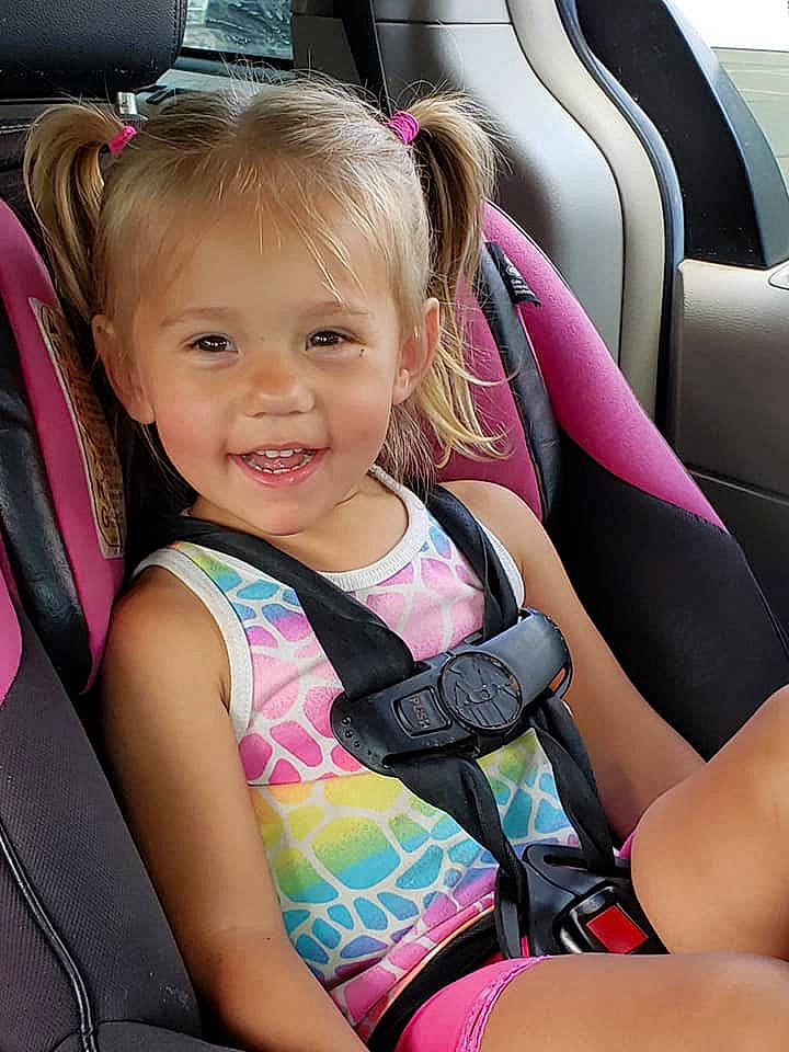 Madison is registered to the contest to win money with this photo: auto_part, baby_carriage, baby_in_car_seat, baby_products, car, car_seat, car_seat_cover, child, joy, person, seat_belt, steering_wheel, toddler