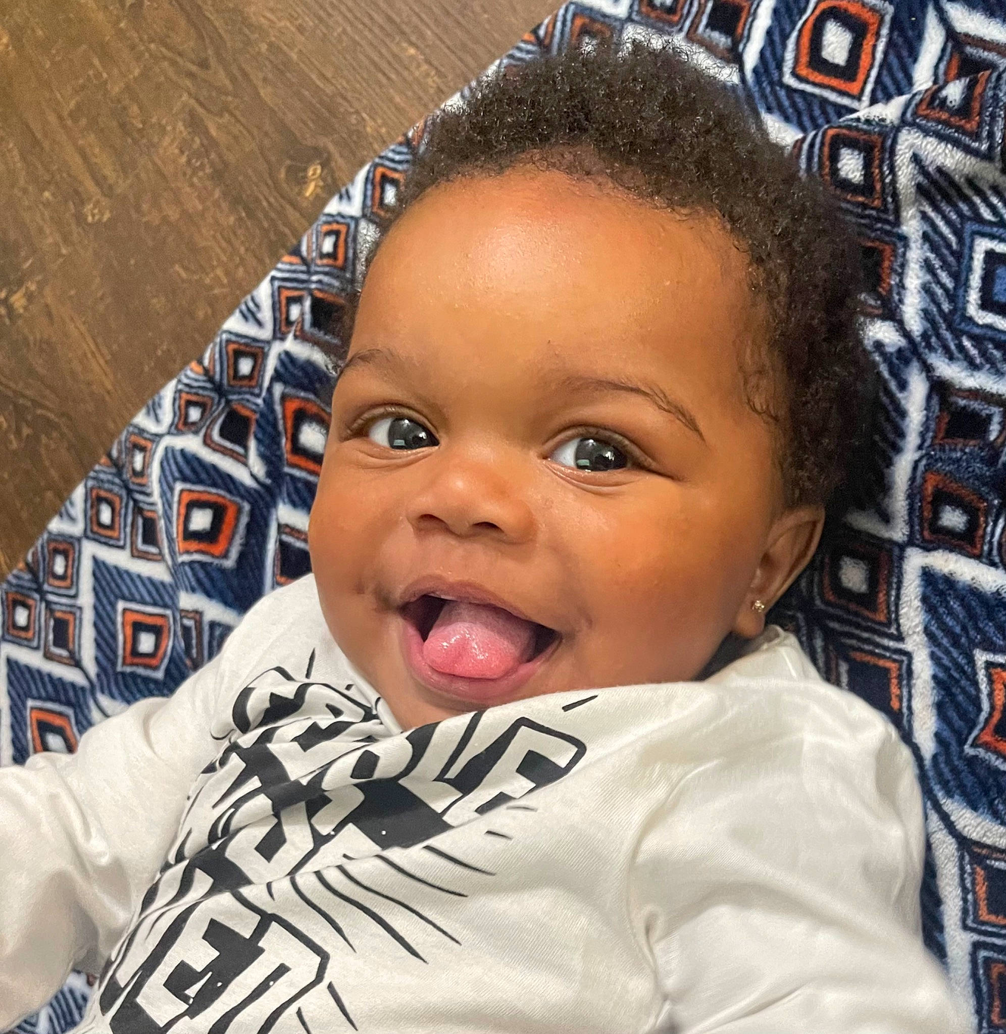 Messiah is registered to the contest to win money with this photo: baby, black_hair, cheek, chin, cool, eye, eyebrow, eyelash, forehead, fun, gesture, hair, hairstyle, happy, head, nose, person, sleeve, smile, t_shirt