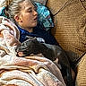 Blue joined the competition — help win amazing prizes! person, dog, sleeping, blanket, couch, pillow, indoor, resting, relaxation, nap, cozy, furniture, animal, pet, comfort, casual, young_adult, home, blue_shirt, textile