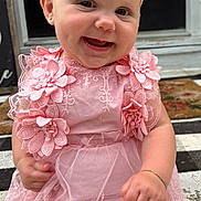 June joined the competition — help win amazing prizes! baby, child, smiling, pink_dress, headband, lace, flower, sitting, happy, cute, portrait, outdoor, doorstep, bracelet, person, infant, young_child, fashion, accessory, front_door