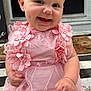 baby, child, smiling, pink_dress, headband, lace, flower, sitting, happy, cute, portrait, outdoor, doorstep, bracelet, person, infant, young_child, fashion, accessory, front_door