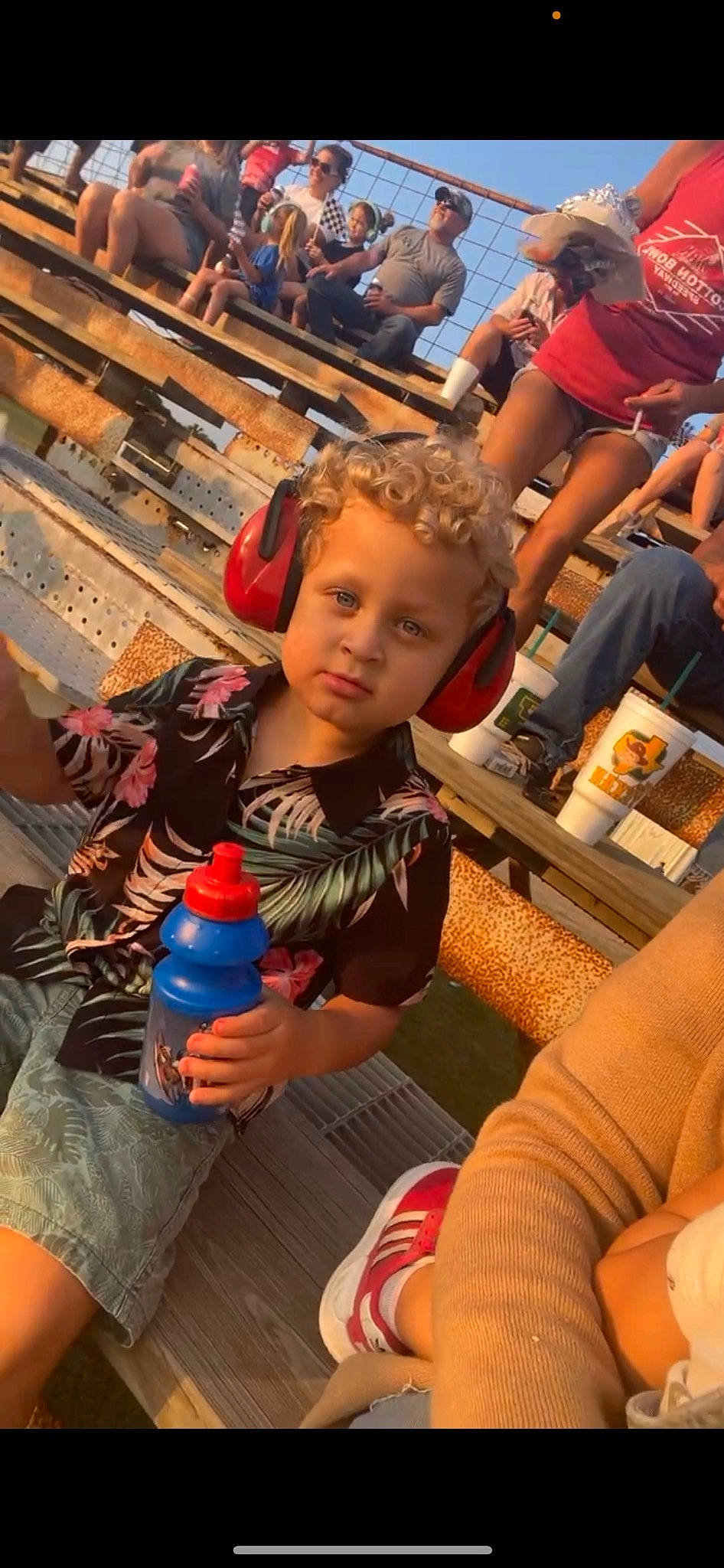 Nathan is registered to the contest to win money with this photo: arm, child, drink, event, fun, hand, leisure, nail, person, plastic_bottle, play, recreation, shorts, sitting, soil, summer, t_shirt, thigh, toddler, vacation